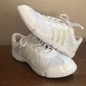 White Adidas cheer shoes, sneakers.